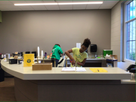Third block library aides whip up drinks at the coffee bar in the media center.