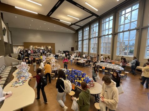On Feb. 16, students use time during Connect to pack sacks of donated food items for the Full Tummy Project.